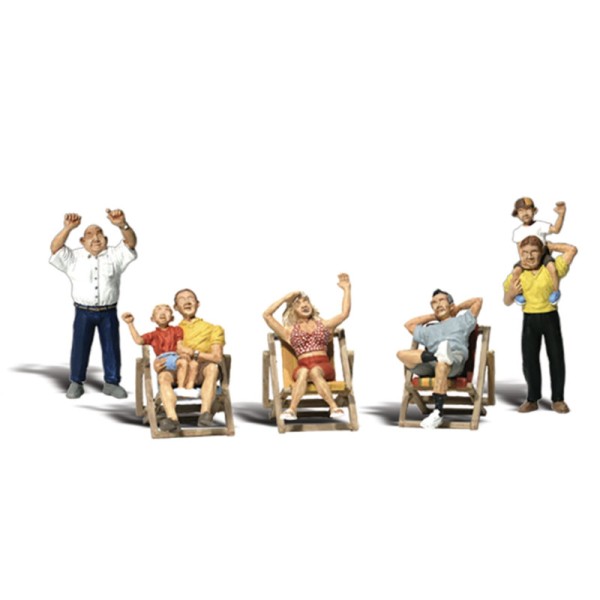 People Sitting in Deck Chairs as Spectators OO